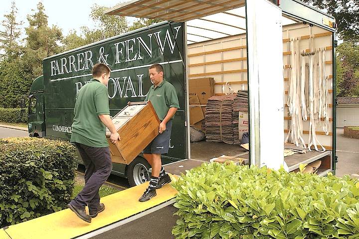 Carrying furniture into removals van